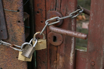 Old door with padlocks. 