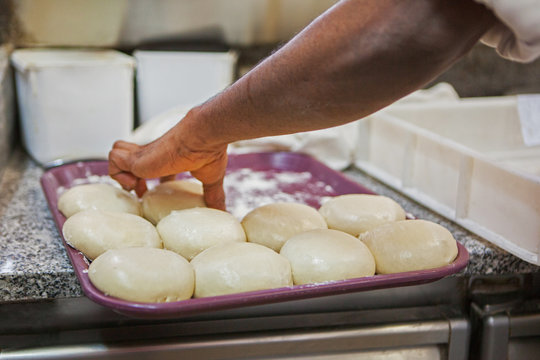 Chef preparing pizza dough in an Italian restaurant