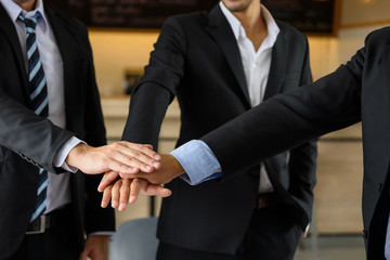 businessman team touching hands, teamwork