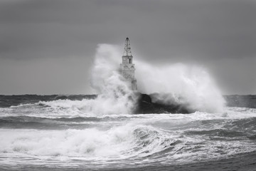 Storm near an old lighthouse in Achtopol bay, Black sea, Bulgaria