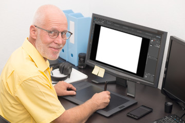 Fototapeta na wymiar man designer using graphics tablet for editing