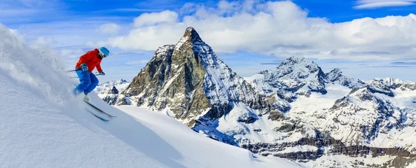 Acrylic prints Winter sports Skiing with amazing view of swiss famous mountains in beautiful winter snow. Matterhorn, Zermatt, Swiss Alps.