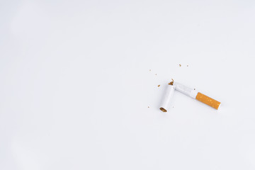 Concept World No Tobacco Day, and a Cigarette Damaged with Isolated White Background