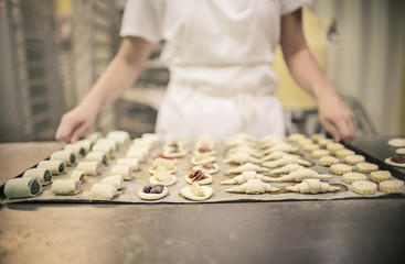 Chef showing salted and sweet food ready to put in the oven