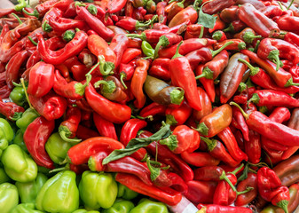 Different types of pepper on the counter.