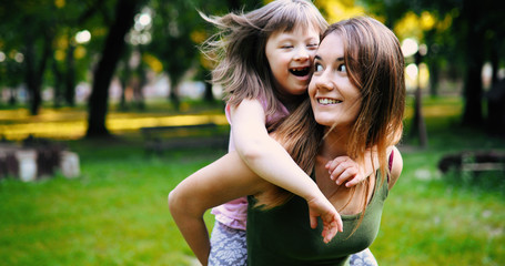 Little girl with special needs enjoy spending time with mother