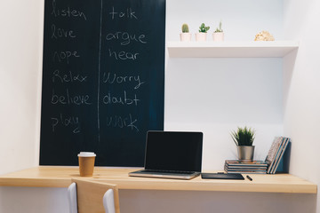 Workplace, study, room with table and written blackboard