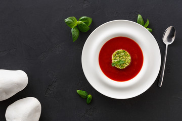 Obraz na płótnie Canvas Cold tomato soup gazpacho with avocado top view