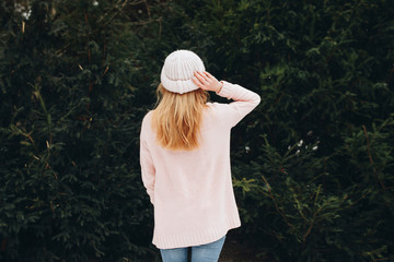 Creative photo of girl in pink clothes on nature background