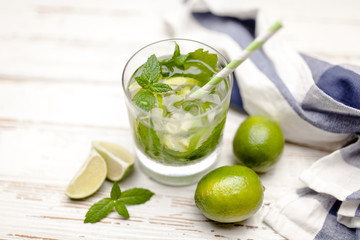 Mojito cocktail on white wood background