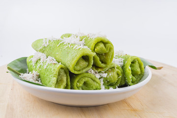 Malaysian traditional cake (Dadar gulung or Ketayap) made from flour, coconut steeped,palm sugar and pandanus flavors