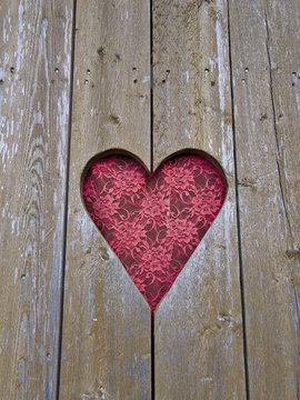 Heart shaped window with red curtain. Valentine's day background.