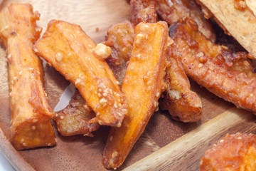 deep-fried sliced banana,taro,sweet potato on wooden plate