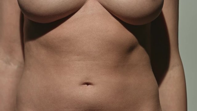 Woman touching her belly.