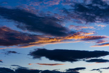 Amazing sky with colored clouds during sunset.