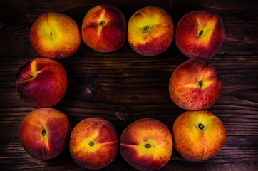 Fresh ripe peaches on wooden table. Top view