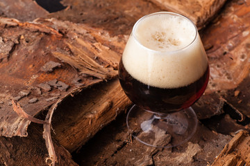 Dark beer on bark