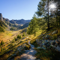 Mountain path in the park of Mercantour (France) to che Col du Fer and Lakes of Vens, at sunset...