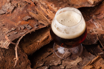 Dark beer on bark