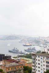 Image of sea bay with buildings, ships