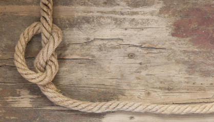 Fototapeta na wymiar Ship rope on the wooden background