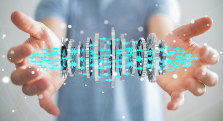 Businessman using floating modern gear mechanism 3D rendering