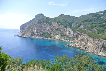 View of mountains and turquoise water to Paleokastritsa Corfou island Greece