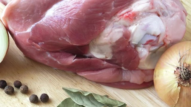 Raw pork knuckle with and onion - ready for coocking
