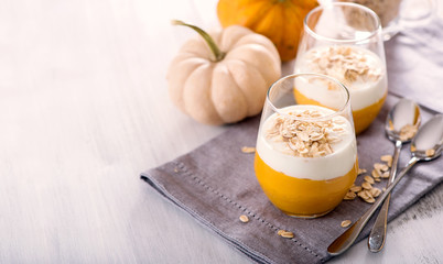 Overnight oats with pumpkin smoothie, healthy cereal breakfast copy space