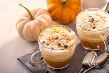 Pumpkin latte, hot caffee drink with pumpkins, whipped cream and spices