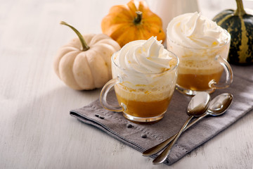 Pumpkin latte, hot caffee drink with pumpkins, whipped cream and spices
