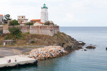 Lighthouse By The Inlet to The Sea