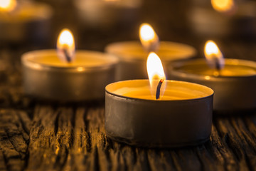 Candles light in advent.. Christmas candles burning at night. Golden light of candle flame