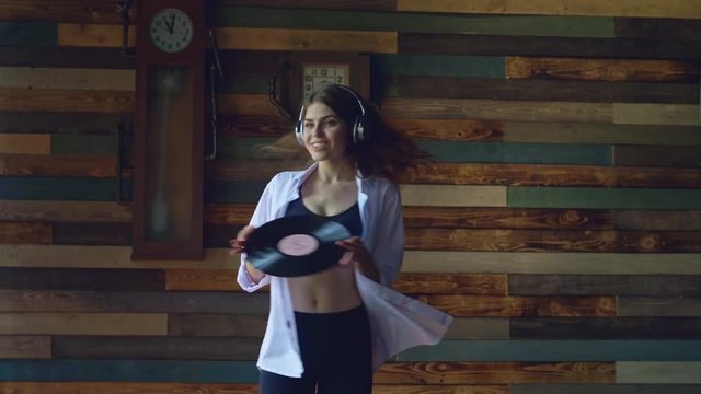 Beautiful girl with musical phonograph record