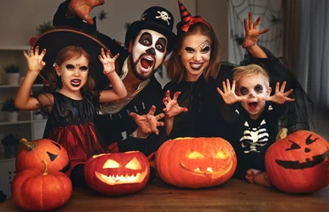 Schilderijen op glas happy family mother father and children in costumes and makeup on  Halloween. © JenkoAtaman