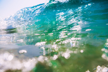 Fototapeta premium Blue wave in ocean. Clear wave and bokeh
