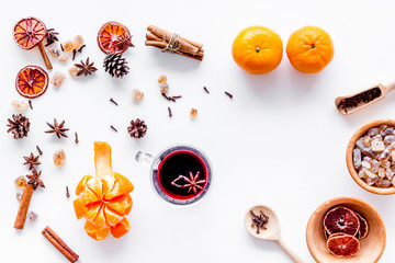 Merry christmas in winter evening with warm drink. Hot mulled wine or grog with fruits and spices...