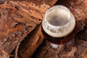 Dark beer on bark