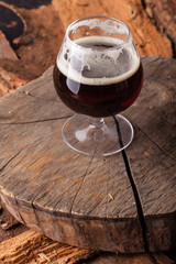 Dark beer on stump