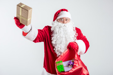 Cheerful Santa Claus giving colorful presents