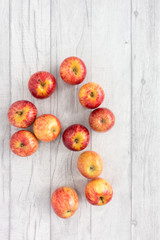 Red Apples on Grey Wood Background