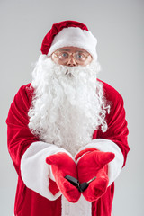 Cheerful Santa Claus presenting keys of car