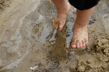 Child's feet in mud