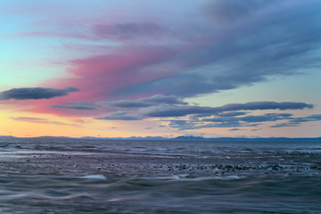 Sunset paint the sky and the sea. The sea of Okhotsk. The Koni Peninsula. Magadan oblast. - obrazy, fototapety, plakaty