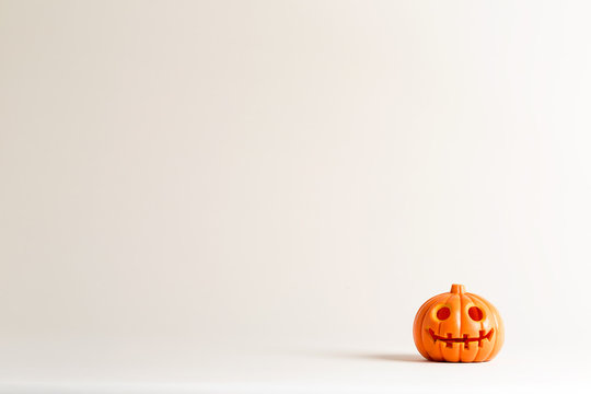Halloween pumpkin ornament on an off white background