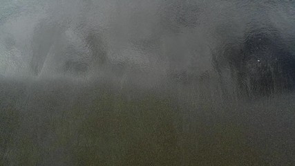 water and waves on a beach with black sand on vulcano island