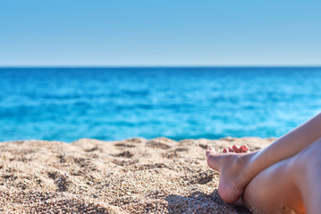 Woman relaxing on the beach.