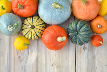 Pumpkins and squashes on wooden boards