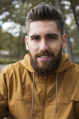 Fototapeta premium Portrait of a man in an fall landscape.