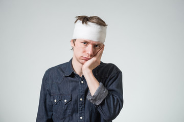 Man with bandage on his head